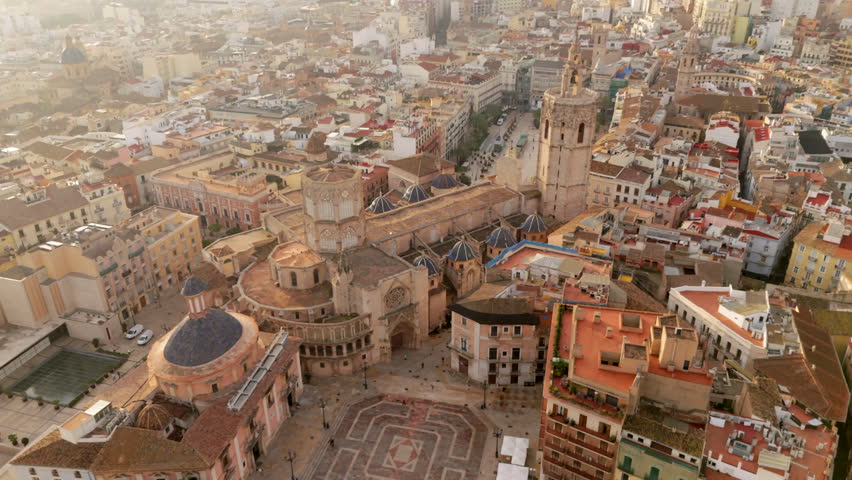 Cinematic Aerial photograph captures the spirit of Valencia, Spain, Metropolitan Cathedral-Basilica of the Assumption of Our Lady of Valencia, architecture and vibrant cityscape, cultural heritage