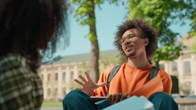 Two African American friends students talk learning together teamwork cooperation friendship girl female woman with guy man male in city outdoors in college university academy campus talking studying - Powered by Shutterstock - Get 15% off with code: PIKWIZARD15