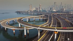 Morning view of the Mumbai Coastal Road in Maharashtra, India, famously known as the 'City of Dreams.' The scene captures a multileveled interchange roadway. A complex road network and urban designs. - Powered by Shutterstock - Get 15% off with code: PIKWIZARD15