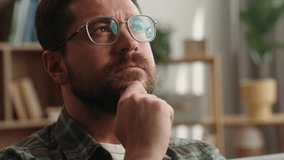 Portrait at home pensive thinking idea solution think ponder bearded man guy thoughtful confused puzzled hesitate male at home apartment loan mortgage insurance searching looking decision holding chin - Powered by Shutterstock - Get 15% off with code: PIKWIZARD15