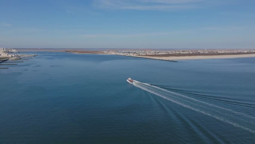 Aerial Drone Footage Of Atlantic City New Jersey On a Perfect Clear Blue Sky Day with No People Ocean Boats Towers Skyscrapers Sunny Epic Viral Cityscape no Traffic Clean Neutral Color