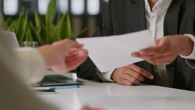 Two unrecognizable business colleagues businessmen men male guys multiracial in office signing paper sign contract document bank insurance table banking credit investment company agreement signed pen - Powered by Shutterstock - Get 15% off with code: PIKWIZARD15