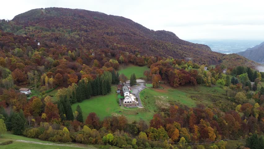 The green and yellow colors of autumn are contrasts of October and November. The beauty of a cinematic drone video provokes: a vacation time