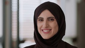 Smiling businesswoman Arabian islamic business woman in hijab fashion Muslim girl close up office portrait healthy toothy dental smile happy female religion arabic beauty face cheerful glad smiling - Powered by Shutterstock - Get 15% off with code: PIKWIZARD15