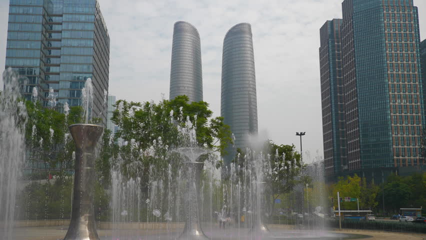 day time chengdu city center famous office buildings mall fountain square panorama 4k china