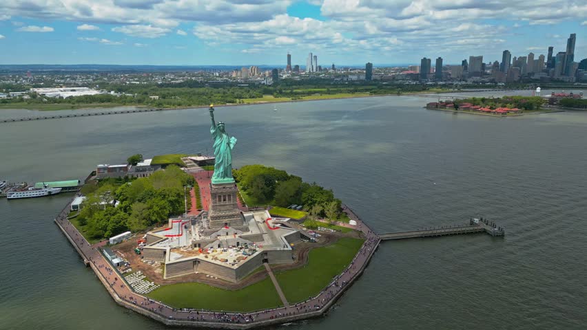 Panoramic aerial view Statue of Liberty in New York City, NY, USA. The Statue of Liberty over the Panorama of NYC. New York city skyline with statue of Liberty. The statue of Liberty and Manhattan.