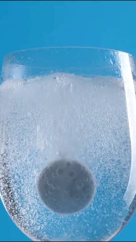 Effervescent tablet dissolving into water
