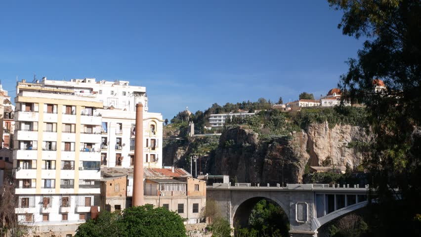 Titl down over El Kantara bridge, abandoned factory and Rhumel gorge in Constantine, Algeria