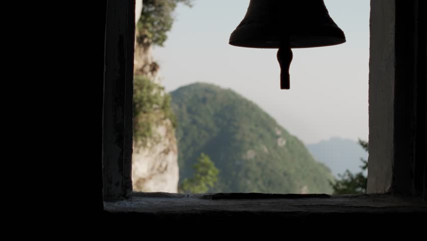 A church bell rings over the Apennine Mountains in Italy.