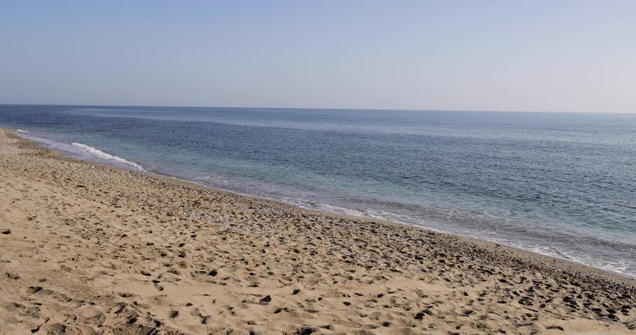 Footage of the beautiful beach front in the town of relaxing beach, waves, spanish beach, sitio de calahonda, calahonda, sunny day, sandy beach, sand, málaga, spanish, sunny, outdoor, scenic, beautifu