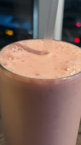 choose strawberry smoothie two smoothies against the backdrop of the evening city on the table smoothie mango and strawberry