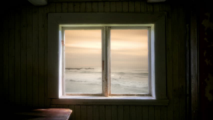 Serene Ocean View Window Frame Rustic House Zoom Out. The calm ocean waves seen through an old wooden window frame create a peaceful sunset view. Zoom out