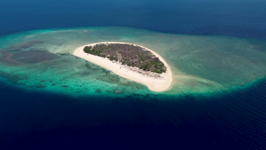 Tabuhan Island drone aerial view, clear water Tabuhan beach. Tabuhan island. Exotic travel vacation getaway, romantic honeymoon destination.