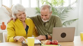 Mature couple discussing finances at home - Powered by Shutterstock - Get 15% off with code: PIKWIZARD15