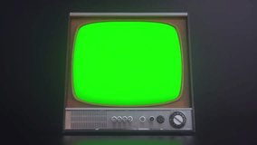 Old TV Set with green screen. Old television with noise and green screen in empty dark studio - Powered by Shutterstock - Get 15% off with code: PIKWIZARD15