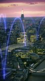 Wireless connections over London. Holographic lines connecting a smart city. Futuristic network. Representing concepts as: Smart city, IOT, AI, cloud computing, wireless technology. Shot in 8K. - Powered by Shutterstock - Get 15% off with code: PIKWIZARD15