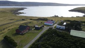 Camera panning over goose green and darwin cemetery with the final resting place of soldiers killed defending against the argentine invasion of 1982 - Powered by Shutterstock - Get 15% off with code: PIKWIZARD15