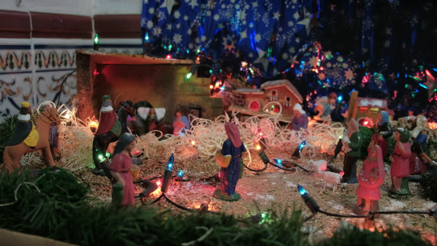 Camera Pan Over Nativity Scene in Spanish House on Christmas Eve with Joseph, Mary, Baby Jesus, Three Wise Men, and Starry Night Background