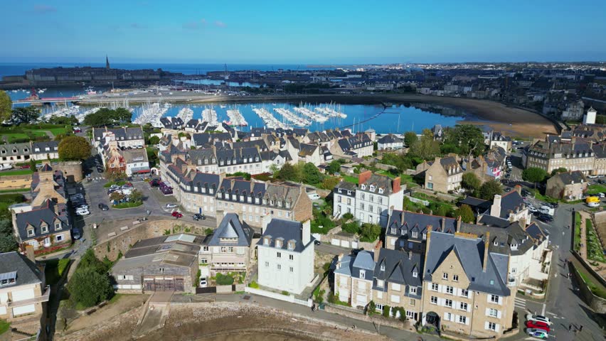 Solidor tower with Port of Bas Sablons and Saint-Malo city in background, Brittany in France. Aerial forward ascending