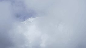 Snowy Nepal Mountains Close Up in Clouds, Snowy Himalayas Snowcapped Mountains Close Up Detail Shot of Mountain Range Ridge in the Cloud, Dramatic Mountains Covered in Snow - Powered by Shutterstock - Get 15% off with code: PIKWIZARD15