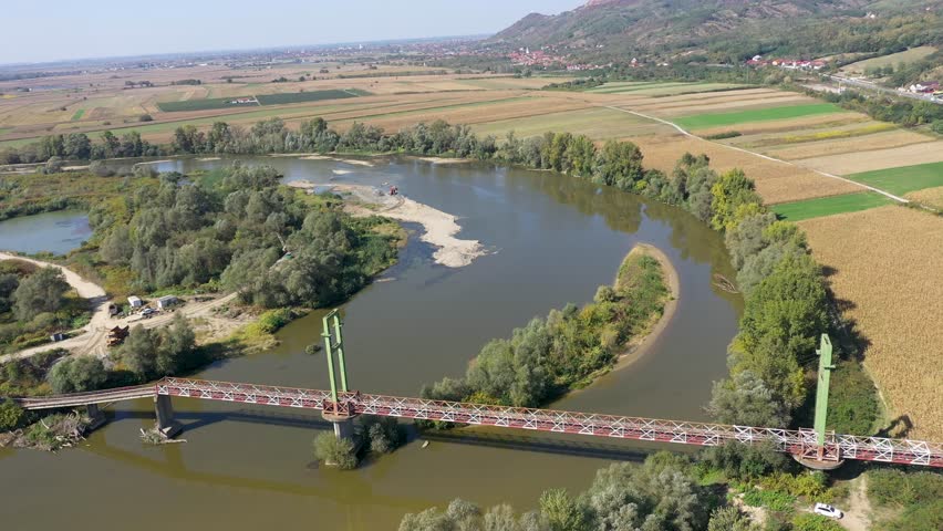 Sand and gravel exploitation in the river aerial view by drone