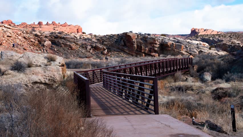 Close up shot of a Metal bridge on a Hiking trail in Arches National Park on a sunny day in.