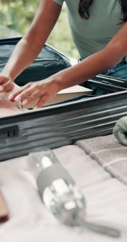 Hands, girl and packing suitcase at house for travel preparation, clothes and organising of vacation. Above, woman and ready of wardrobe in luggage, hospitality and holiday trip of abroad destination