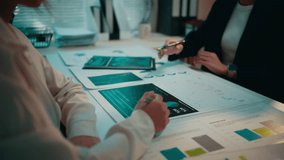 Businesspeople engage in a meeting, discussing financial data presented on paper and a digital tablet. Collaboration and analysis drive strategic decision-making in the office - Powered by Shutterstock - Get 15% off with code: PIKWIZARD15