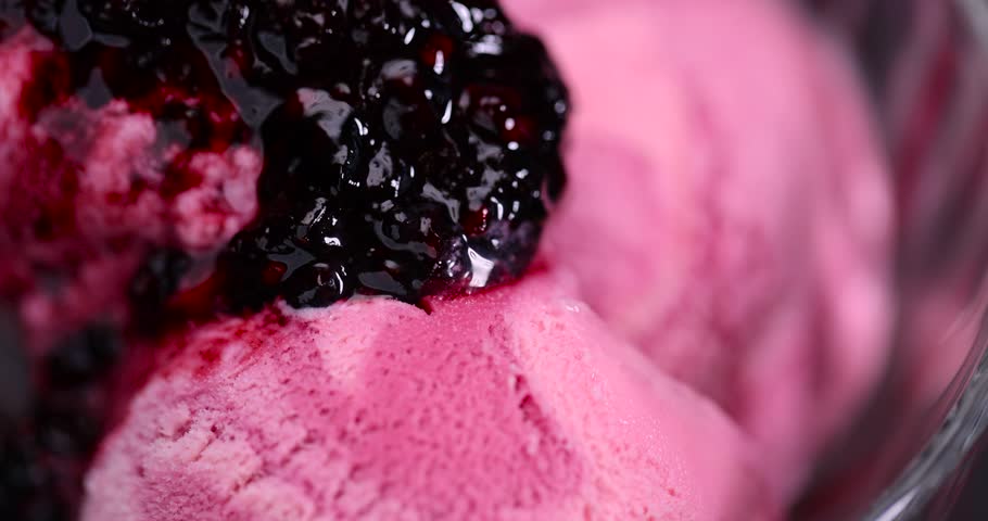 cream ice cream with ripe raspberries and blackberries, delicious ice cream with sugar and raspberry-blackberry flavor with raspberry and blackberry berry jam