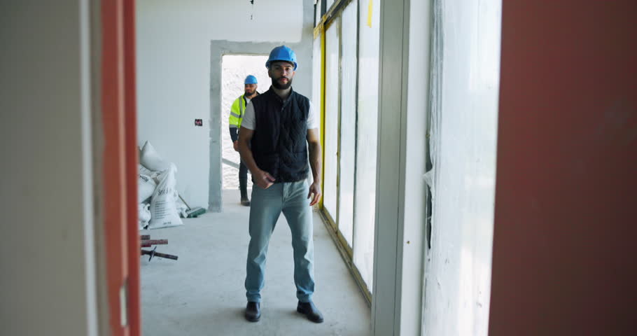 Builder, face and man with arms crossed for construction site progress or project management. Happy, engineering or confident contractor with helmet for building safety, labor or structure inspection