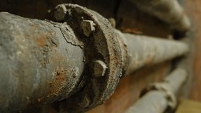 Rust-covered pipes with severe corrosion and flaking layers, highlighting industrial wear and aging textures, perfect for themes of decay or abandonment. - Powered by Shutterstock - Get 15% off with code: PIKWIZARD15