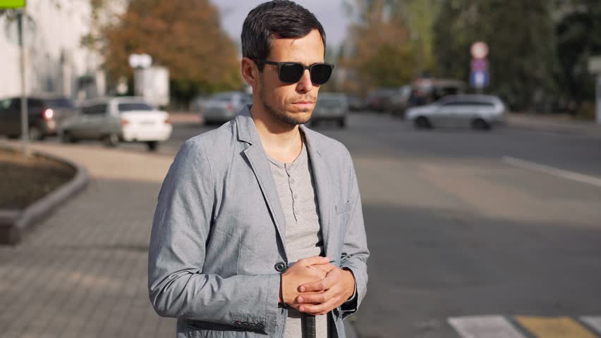 Portrait of a Visually Impaired Man in an Urban Setting