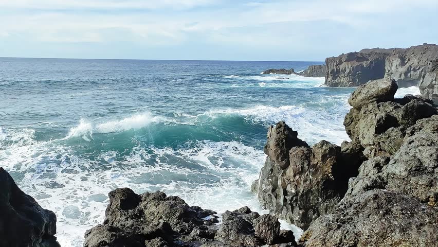 Seascape. Rocky shore of a raging ocean. Lanzarote, Canary Islands. Spain.