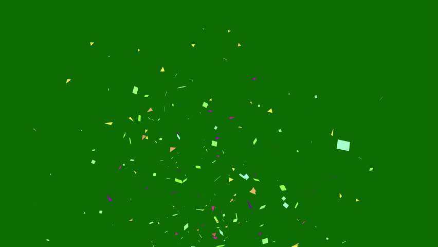 Explosion of multicolored confetti falling on a green background