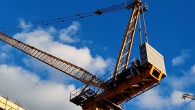 Tower crane or mobile crane erected beside under construction building.
Yellow color Tower crane used for lifting heavy items from ground to top level.
Building Cranes for under construction buil - Powered by Shutterstock - Get 15% off with code: PIKWIZARD15