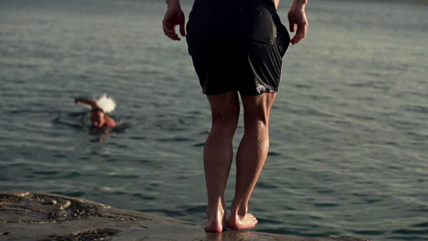 Man jumping into water, super slow motion, shot at 240fps
