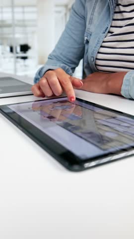 Analyzing House Floor Plan On Digital Tablet