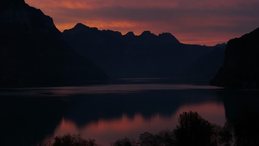 Twilight over the serene Walensee Lake in Switzerland, capturing the beauty of the Swiss Alps.