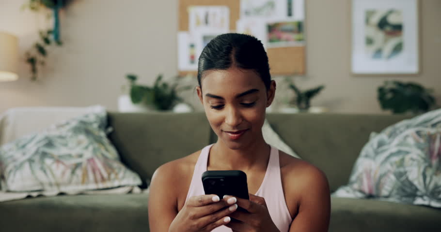 Happy woman, fitness and winning with phone for good news, healthy goals or achievement at home. Excited, female person or yogi with smile on mobile smartphone for workout success or yoga at house