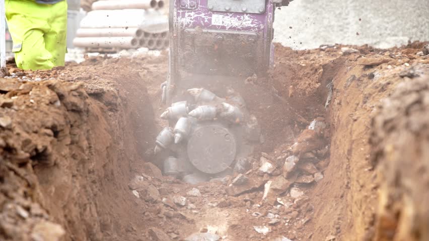 Excavation activity showing rockwheel digging in a construction site