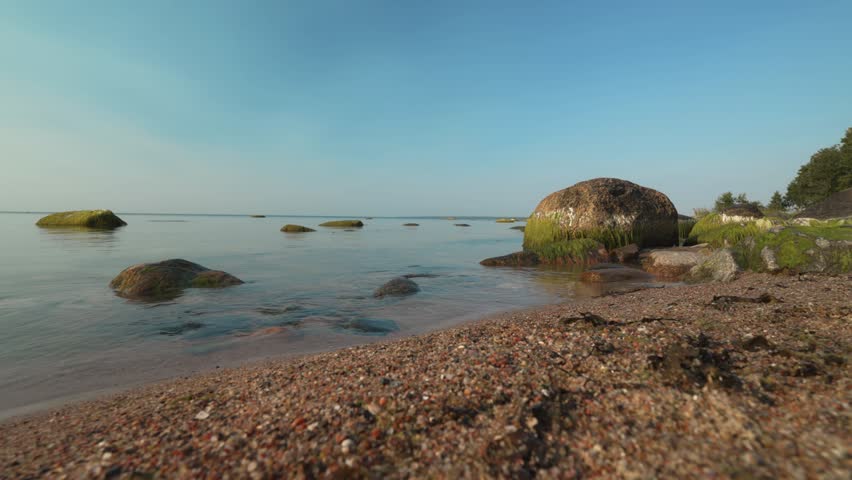 Baltic sea coast with boulders and stones.
