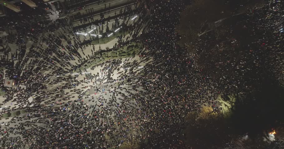aerial drone shot of manifestation. People protesting Protest in country Georgia, Tbilisi to Government for suspending relationships with EU. Crowd of people. Translation: Make some noice
