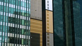 Glass Facade Windows Of Modern Office Buildings In Jongno-gu District In Seoul, South Korea. Tilt Up Shot - Powered by Shutterstock - Get 15% off with code: PIKWIZARD15