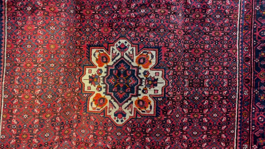 Closeup detail of a traditional Moroccan Berber carpet with beautiful pattern. Moroccan berber symbols and design, abstract background, 4k footage.
