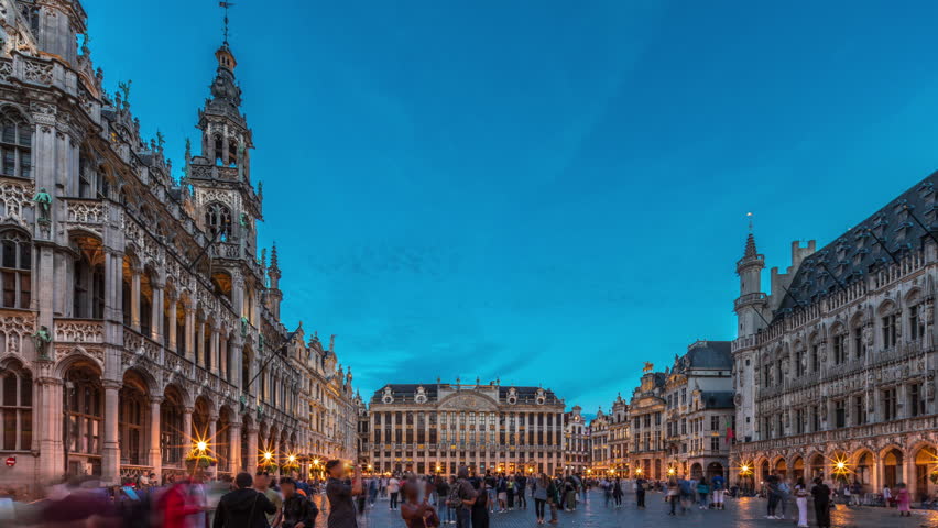 The Grand-Place (Grote Markt) day to night transition timelapse hyperlapse in Brussels, Belgium. Brabantine Gothic Town Hall, Maison Grand-Place and tourists in the historic city center after sunset