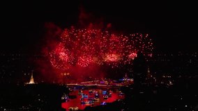 Powerful large scale grandiose flash lights fireworks sparks explosions in the sky among buildings skyscrapers night city, Firework display and light show at Bangkok’s River to promote tourism - Powered by Shutterstock - Get 15% off with code: PIKWIZARD15