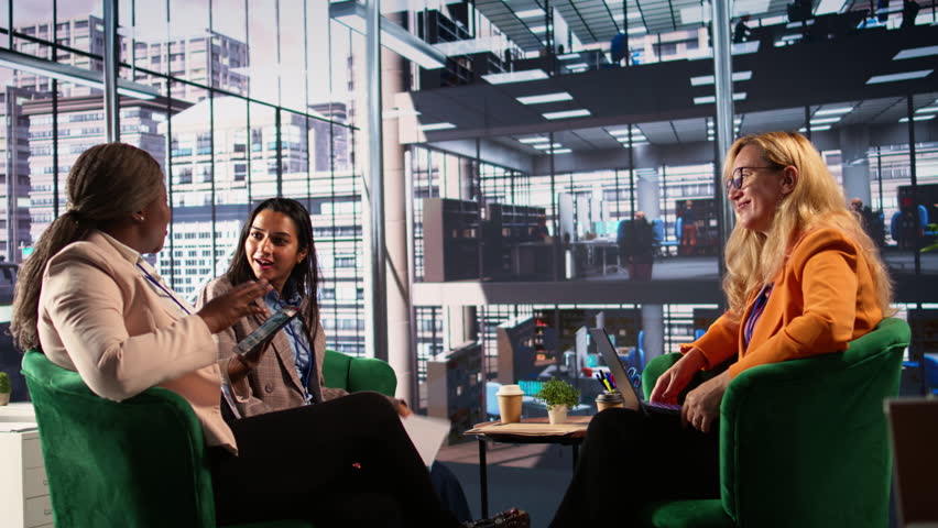Ambitious businesswomen collaborating in a corporate office, fostering gender equality in a men dominated business industry. and leadership growth. Success driven powerful leaders. Camera B.