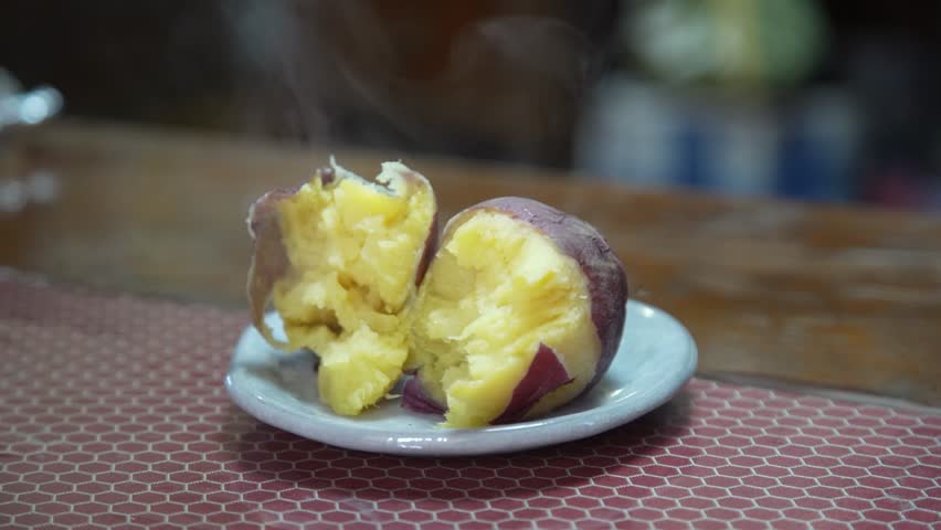Steaming roasted sweet potato on a plate
