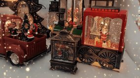 Christmas tree decorations with sparkles on the table. Red car with elves and a Christmas tree, Lantern, locomotive with Santa Claus, New Year. Christmas mood. Horizontal video 4k. - Powered by Shutterstock - Get 15% off with code: PIKWIZARD15
