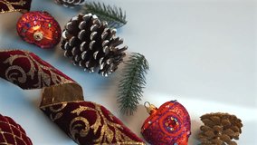 Christmas ornament with gold filigree rests near textured pinecones, rich crimson velvet ribbon, vivid green sprigs, embodying opulent holiday charm with regal details. - Powered by Shutterstock - Get 15% off with code: PIKWIZARD15